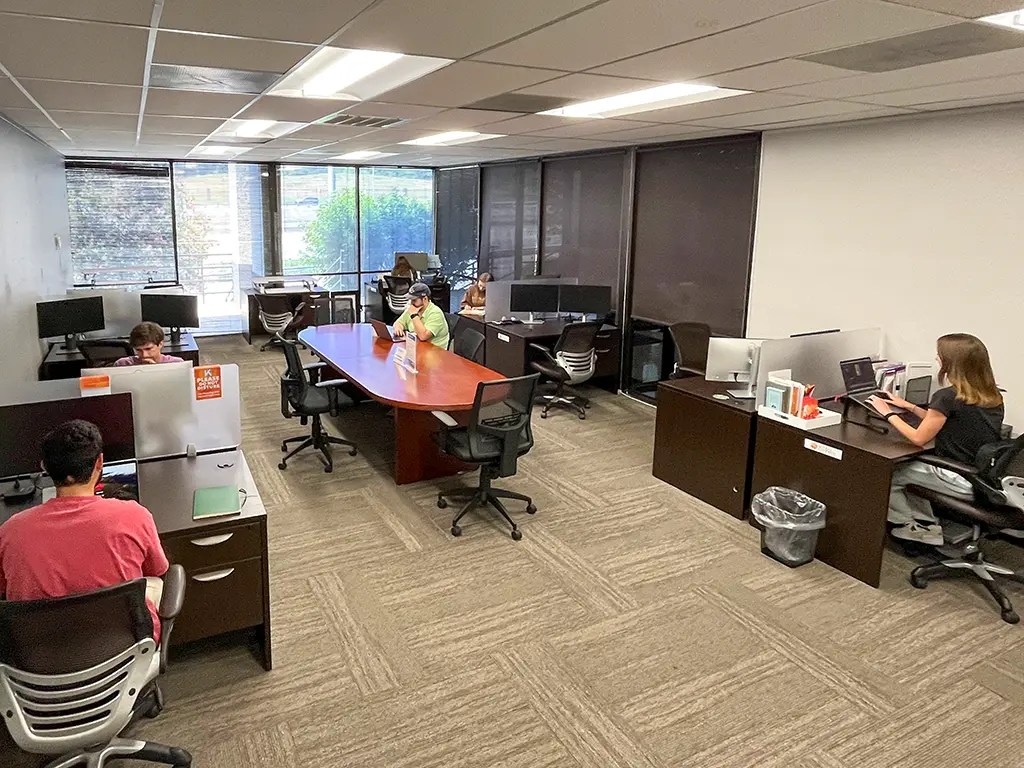 Flex desk coworking area with open seating and modern workstations at Kinected Coworking San Antonio