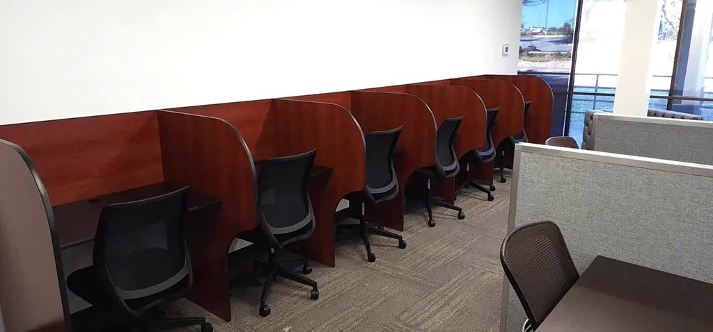 Flex desk coworking space with private workstations in San Antonio