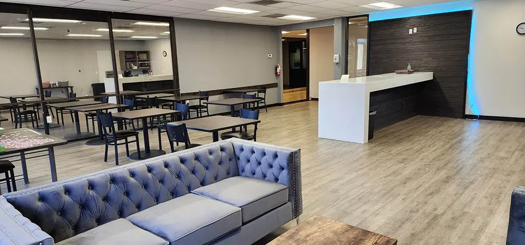 Kinection Lounge coworking space with seating area and coffee shop at Kinected Coworking San Antonio