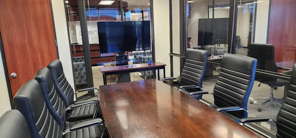 Lion Conference Room whiteboard and seating for eight in San Antonio