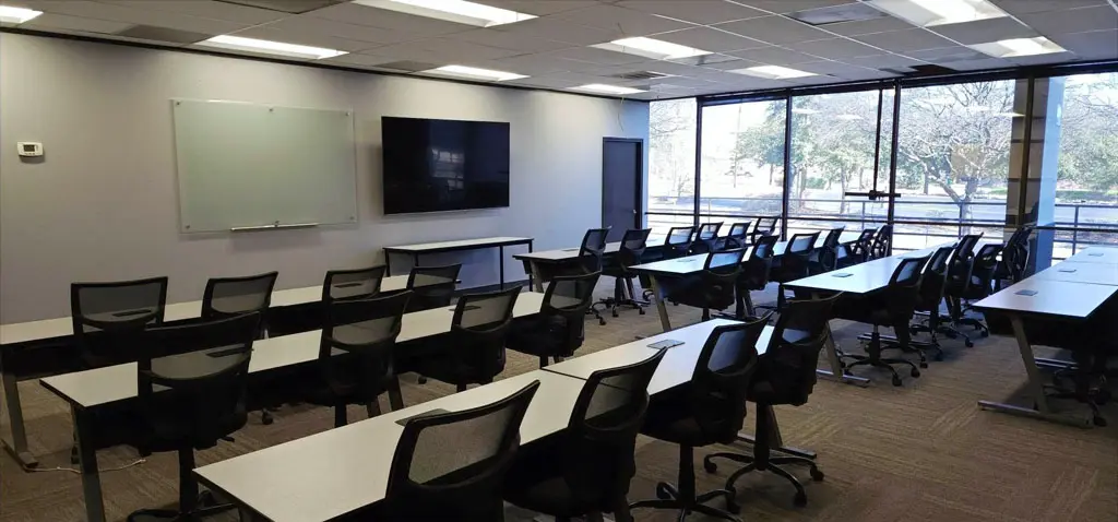 Training Center (Dolphin Room) classroom-style seating with rolling chairs and natural light in San Antonio