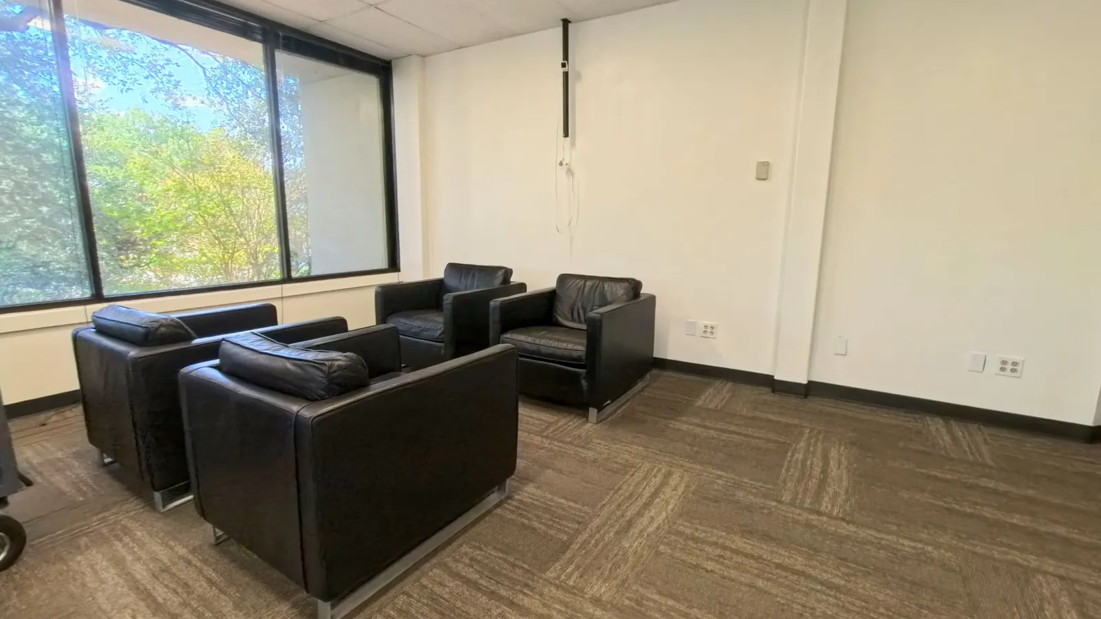 Room 221 lounge and breakout seating area with natural light